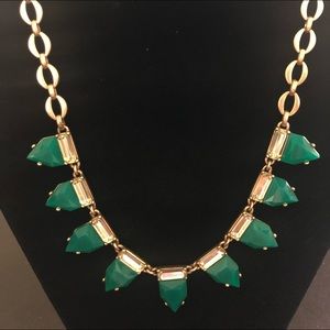 Gold and emerald color necklace.